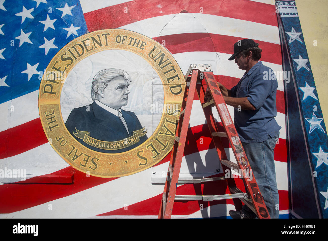 Leo Stack, a local artist and U.S. army veteran in Ft. Myers, FL paints a portrait of the incoming president, Donald J. Trump. Stock Photo