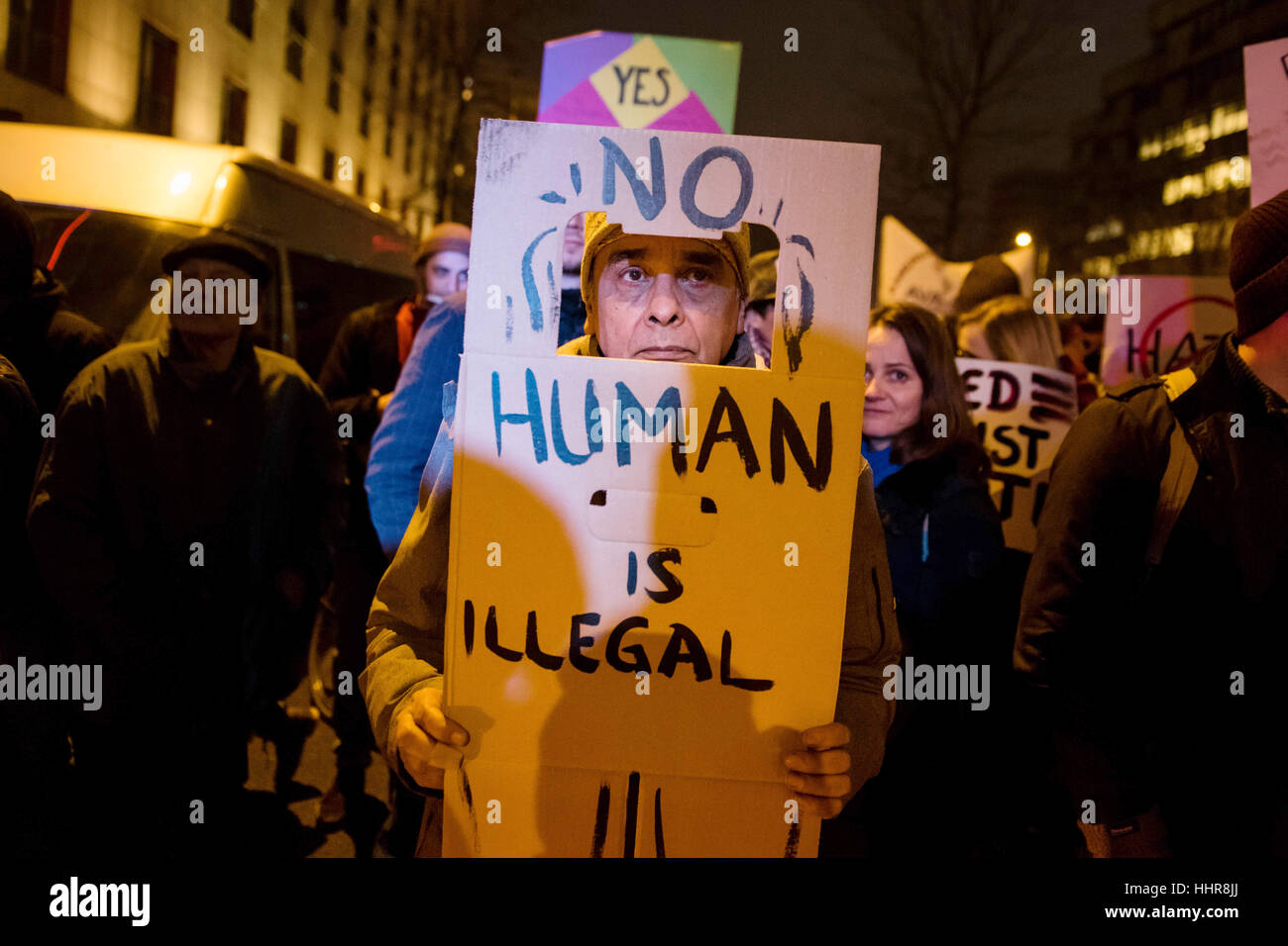 Berlin, Germany. 20th Jan, 2017. A participant holding up a sign that reads 'No Human is illegal' at the demonstration 'Nein zum weltweiten Trumpismus' (lt. No to worldwide Trumpism) from the initiative 'The Coalition' in Berlin, Germany, 20 January 2017. Photo: Gregor Fischer/dpa/Alamy Live News Stock Photo