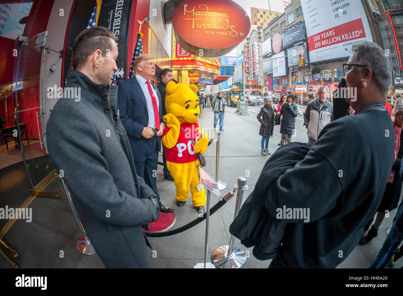 New York, USA. 20th Jan, 2017. Tourists pose for photographs with a wax figure of President Donald Trump in front of Madame Tussaud's Wax Museum in Times Square after the inauguration of Trump as the 45th president of the United States on Friday, January 20, 2017. ( © Richard B. Levine) Credit: Richard Levine/Alamy Live News Stock Photo