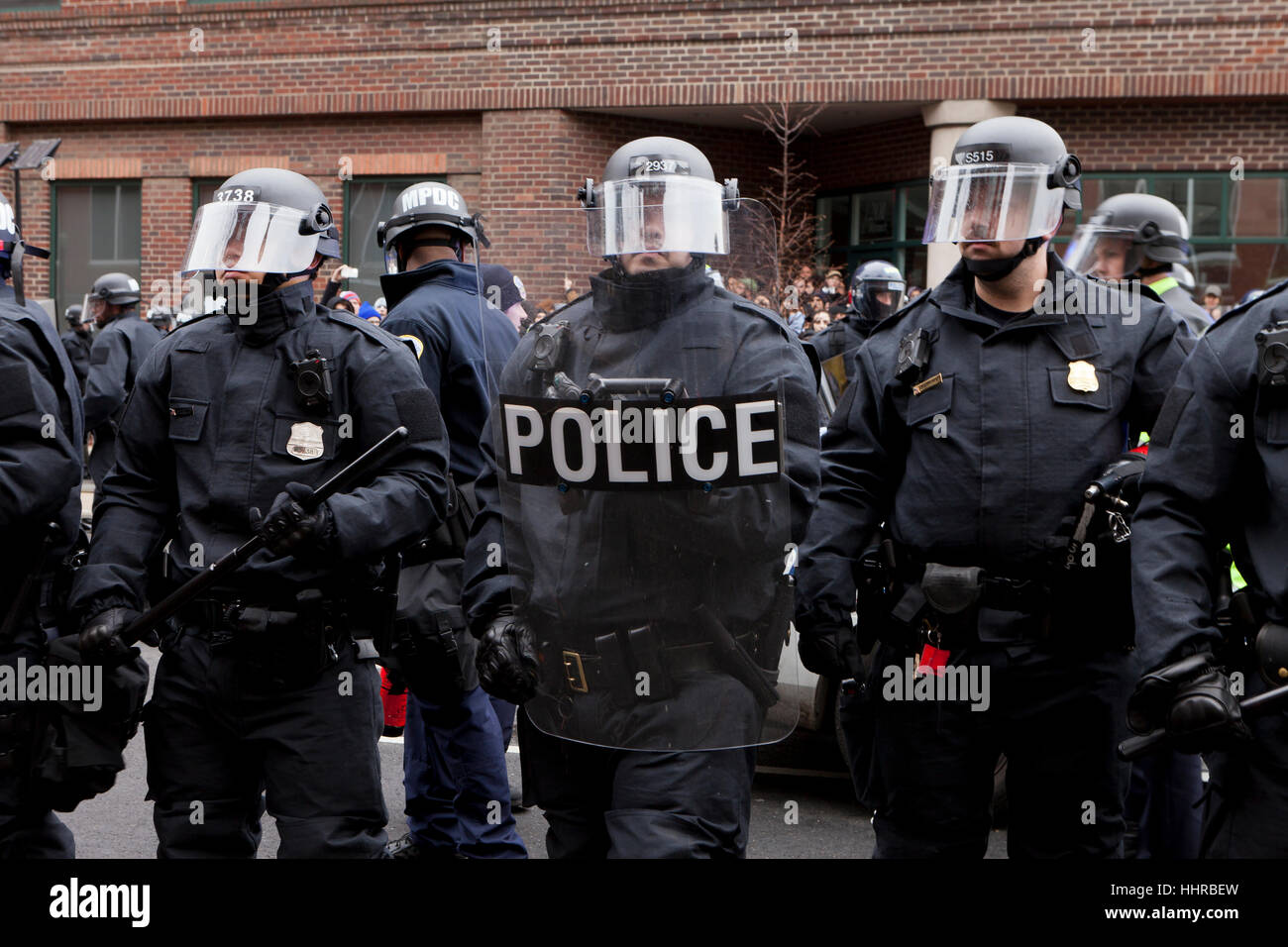 Washington, USA. 20th January, 2017.  Thousands of anti-Trump protesters march just outside of the presidential inauguration security perimeter. Many protesters clashed with riot police. Credit: B Christopher/Alamy Live Newszzz Stock Photo