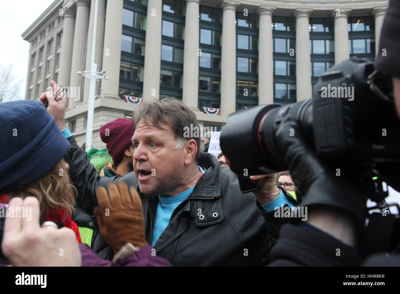Washington, USA. 20th January, 2017. A Trump supporter confronts protesters at rally held by the ANSWER Coalition on the day of the inauguration of Donald J Trump as President of the United States. Credit: Susan Pease/Alamy Live News Stock Photo
