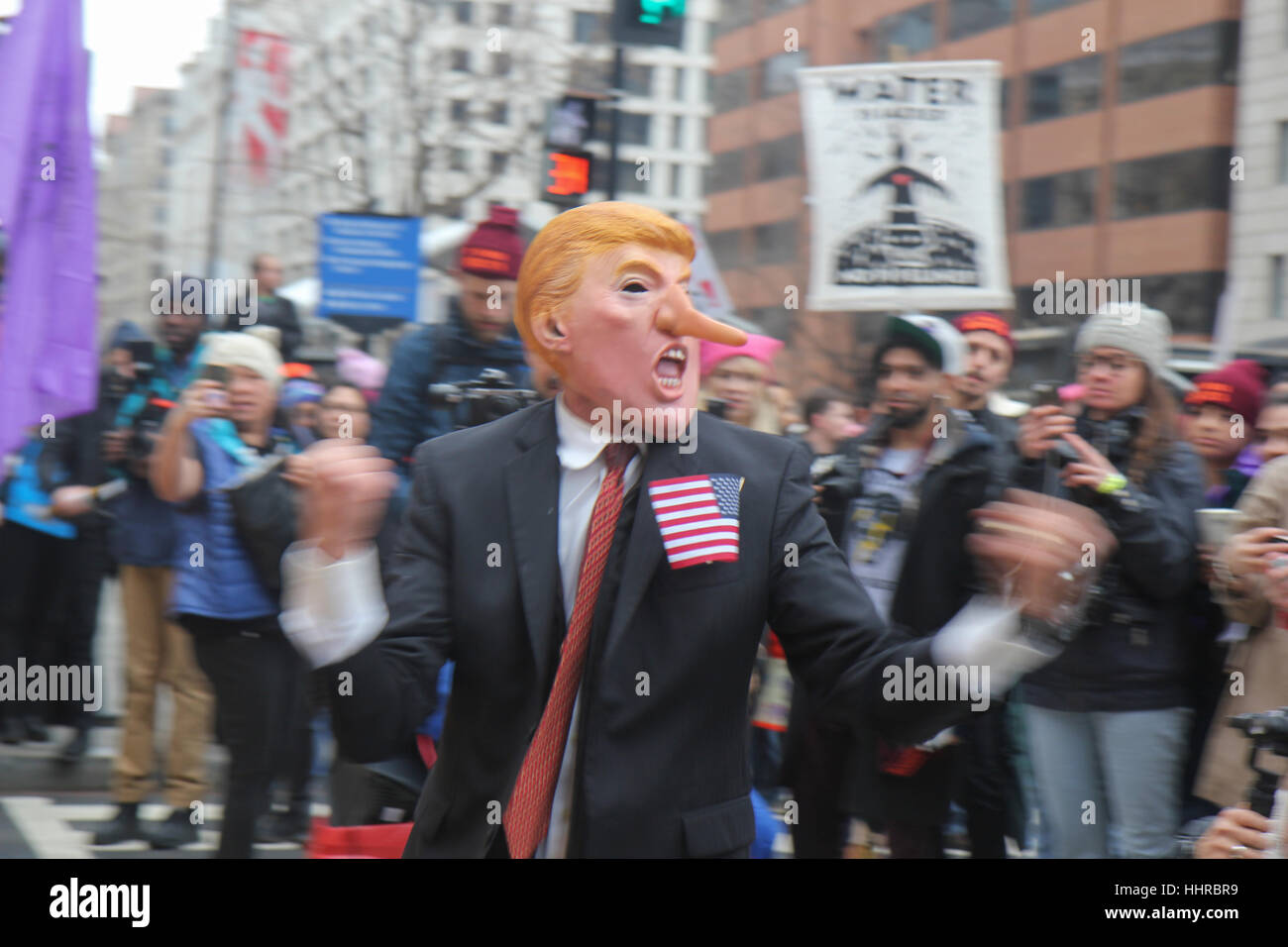 Washington, USA. 20th January, 2017. A protester wearing a Donald Trump mask lampoons the new president on the day of the inauguration of Donald J Trump as President of the United States. Credit: Susan Pease/Alamy Live News Stock Photo
