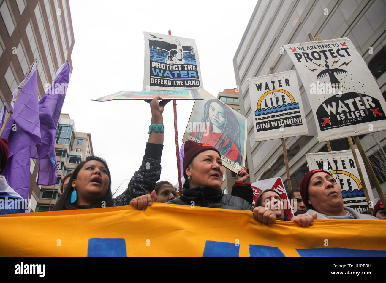 Washington, USA. 20th January, 2017. Protesters opposed to the Dakota Access Pipeline in North Dakota march through the streets on the day of the inauguration of Donald J Trump as President of the United States. Credit: Susan Pease/Alamy Live News Stock Photo