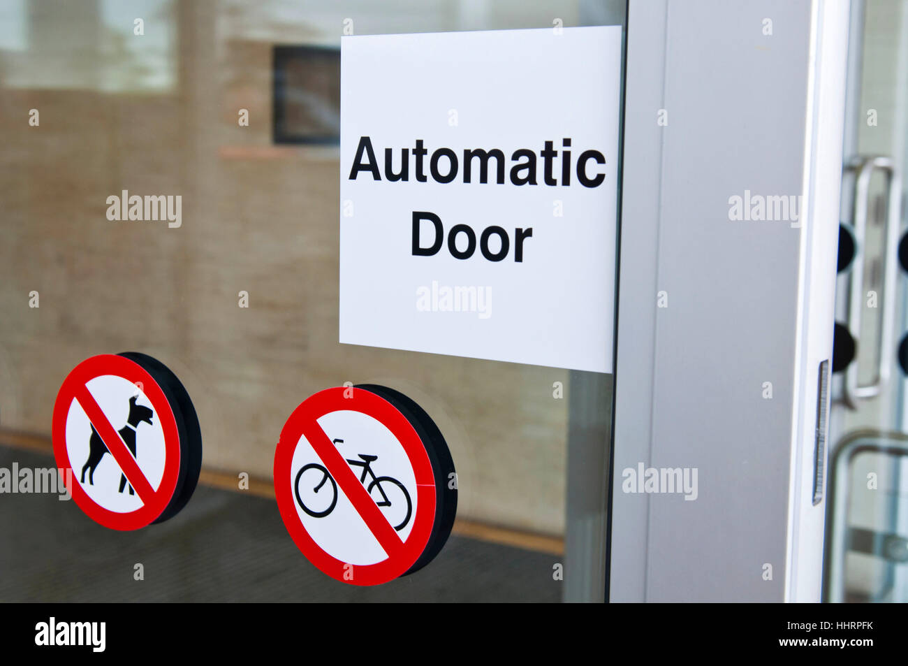 Automatic Doors Signshop automatic door sign on shopping mall entrance (dogs and bicycles are ...
