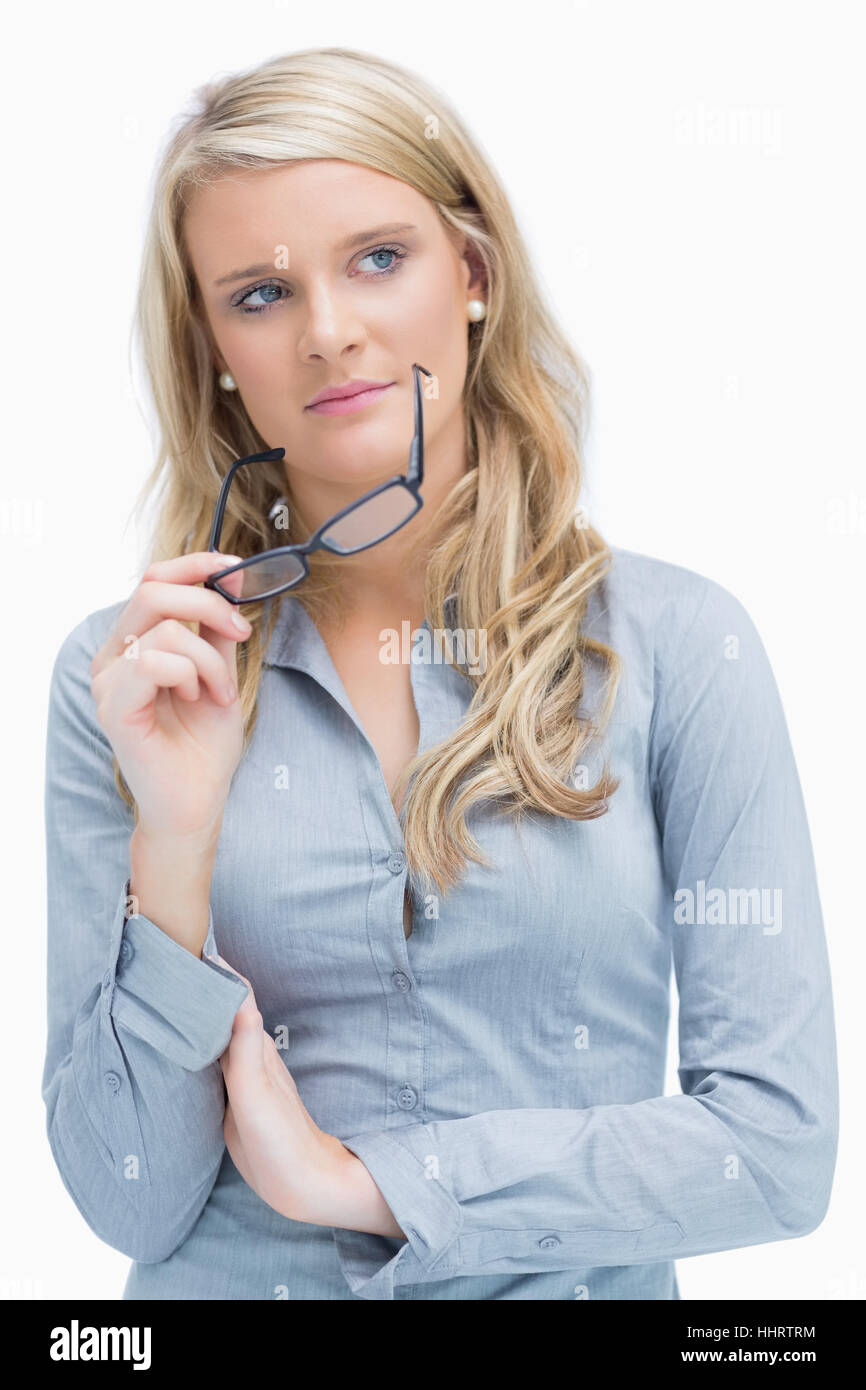 Woman taking glasses off while having arms crossed Stock Photo Alamy