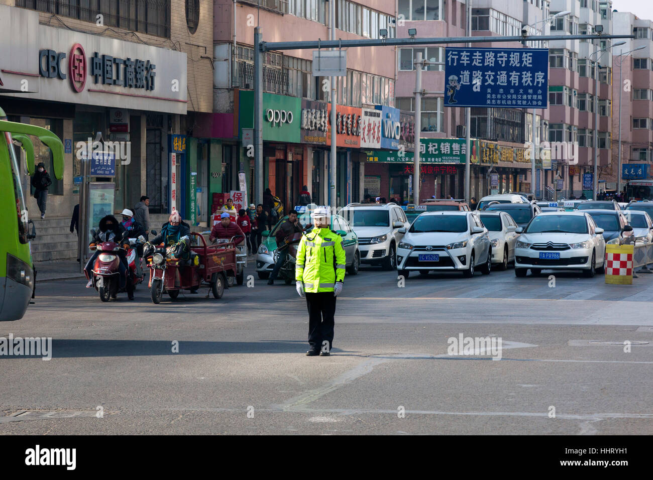 Police controling traffic at road junction, Wuzhong, Ningxia province, China Stock Photo