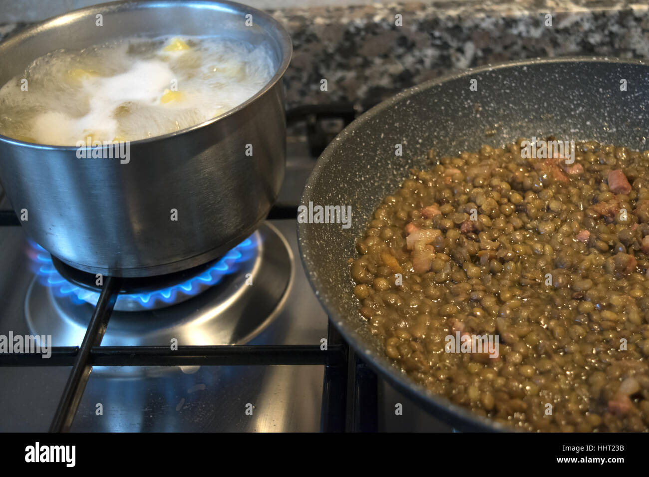 lentils and pasta cooking on the stove Stock Photo