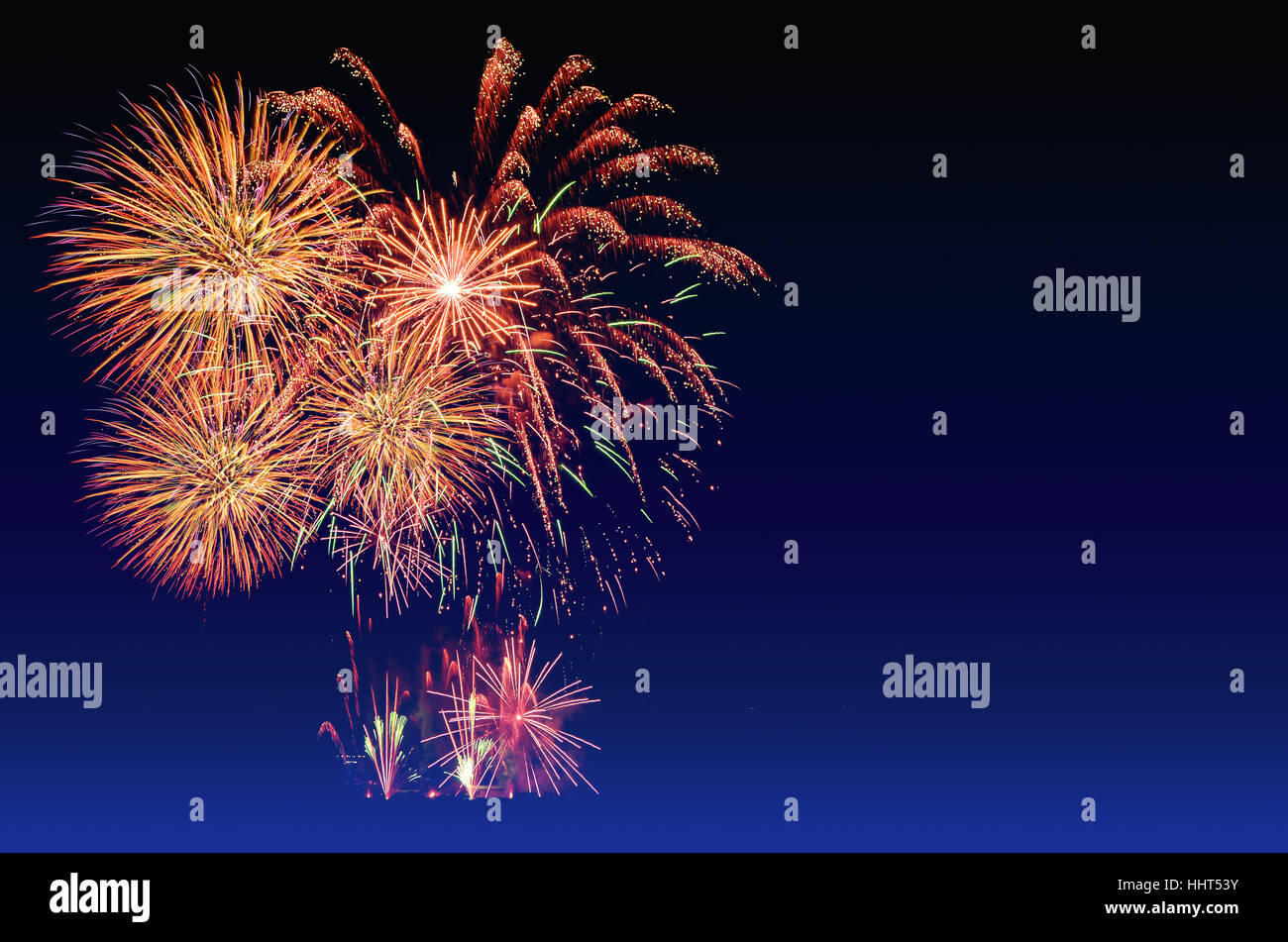 Colorful fireworks celebration and the twilight sky background. Stock Photo