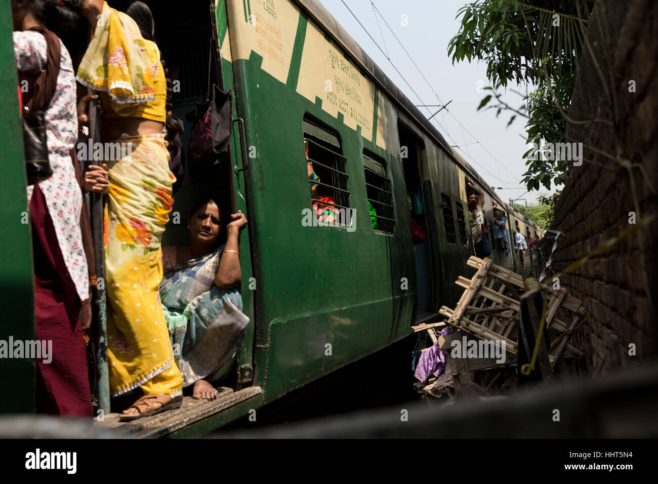 Local train passing through Kolkata Circular Railway Slum, Kolkata, West Bengal, India Stock Photo