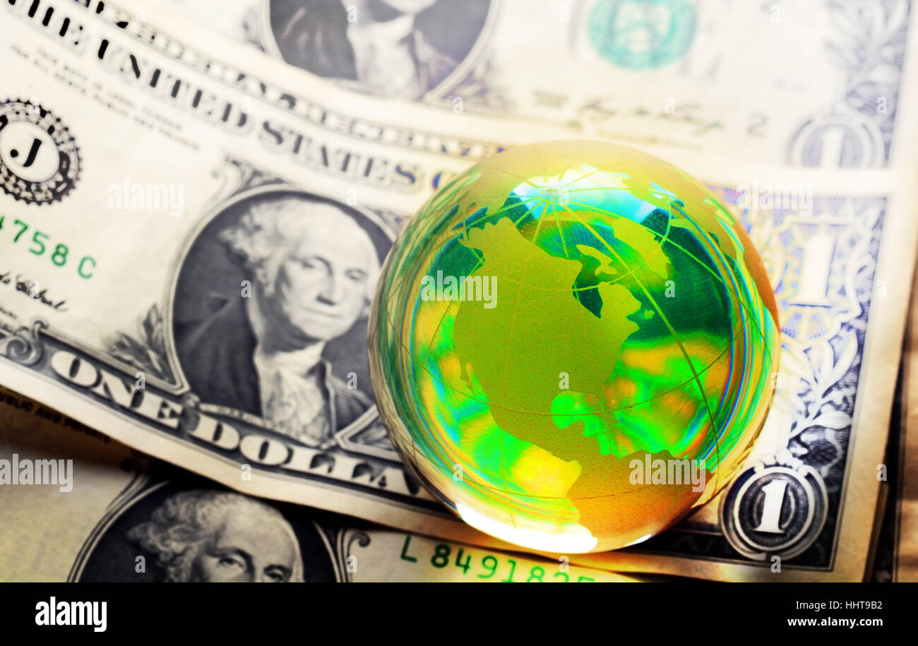 Glass globe and reflection of dollar bill Stock Photo - Alamy