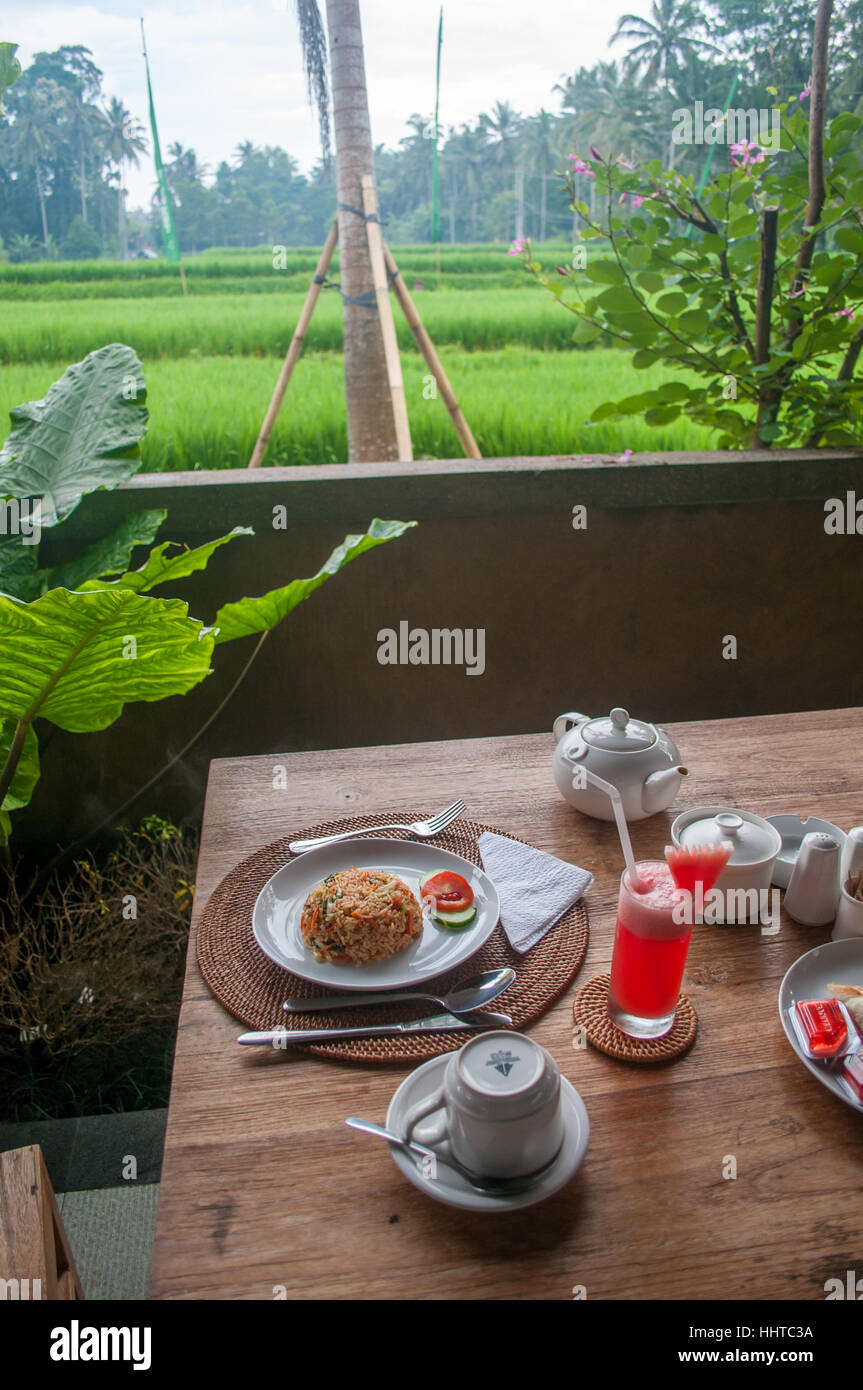 Breakfast served on top of a table on the terrace, Ubud, Bali, Indonesia Stock Photo