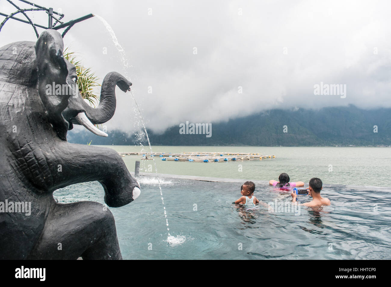 People taking a bath at Toya Devasya hotsprings, Bali, Indonesia Stock Photo
