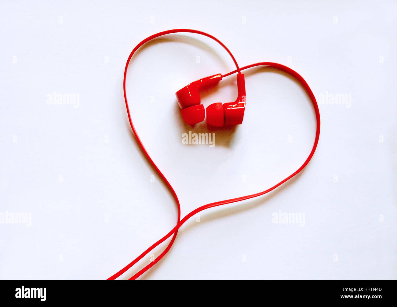 Headphones earphones red heart shape on white background Love
