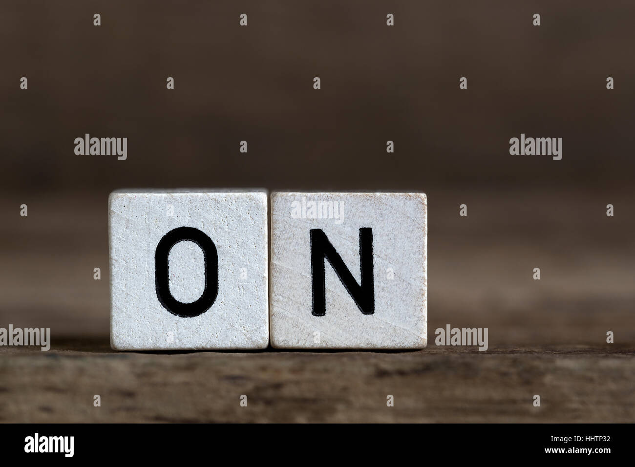 On, written in cubes on wooden background Stock Photo