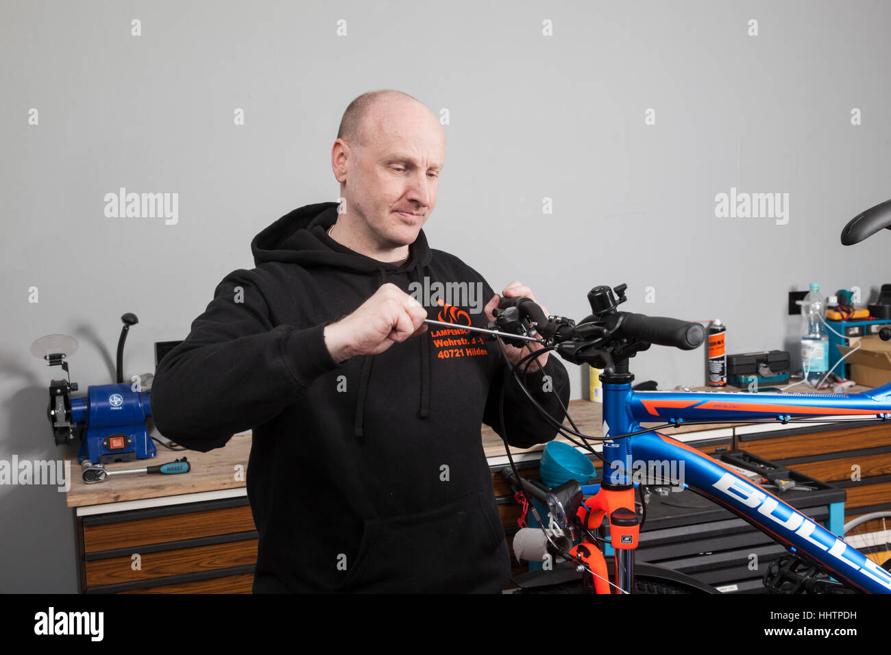 A bicycle mechanic during the inspection at a mountain bike in his