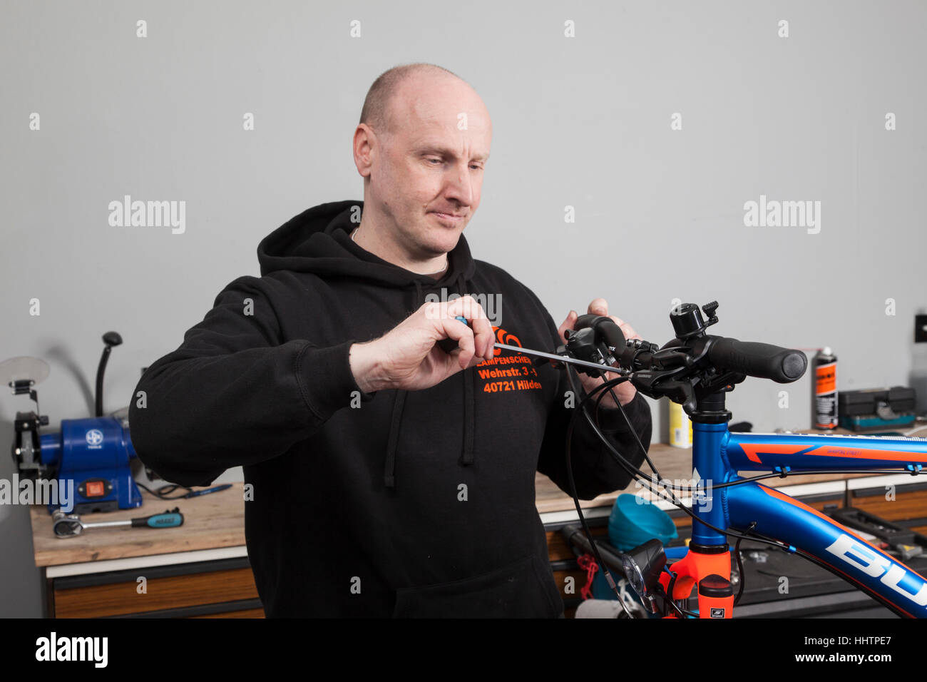A bicycle mechanic during the inspection at a mountain bike in his