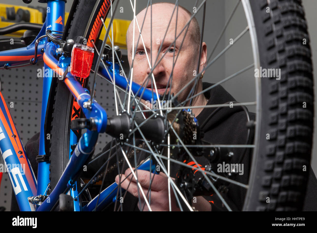A bicycle mechanic during the inspection at a mountain bike in his