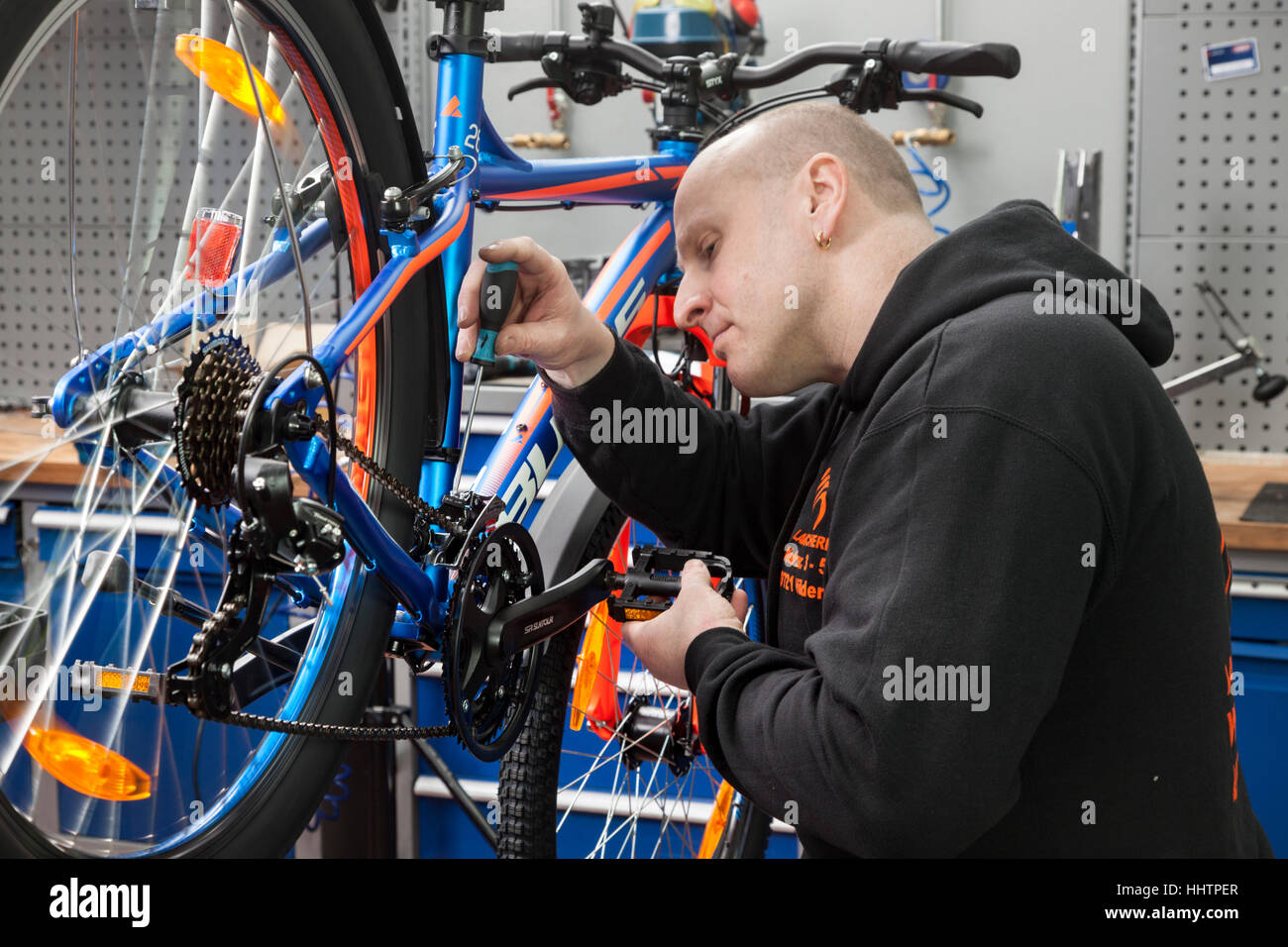 A bicycle mechanic during the inspection at a mountain bike in his
