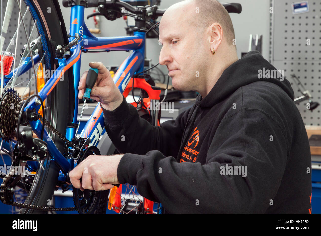 A bicycle mechanic during the inspection at a mountain bike in his