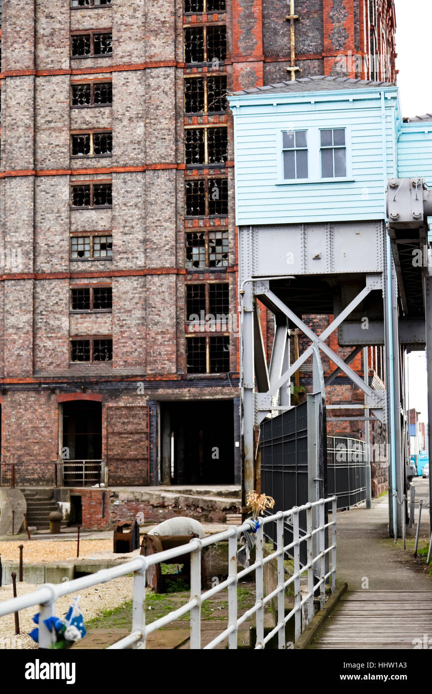 Part of the machine room of the Stanley Docks bascule bridge with the Tobacco Warehouse in the background Stock Photo