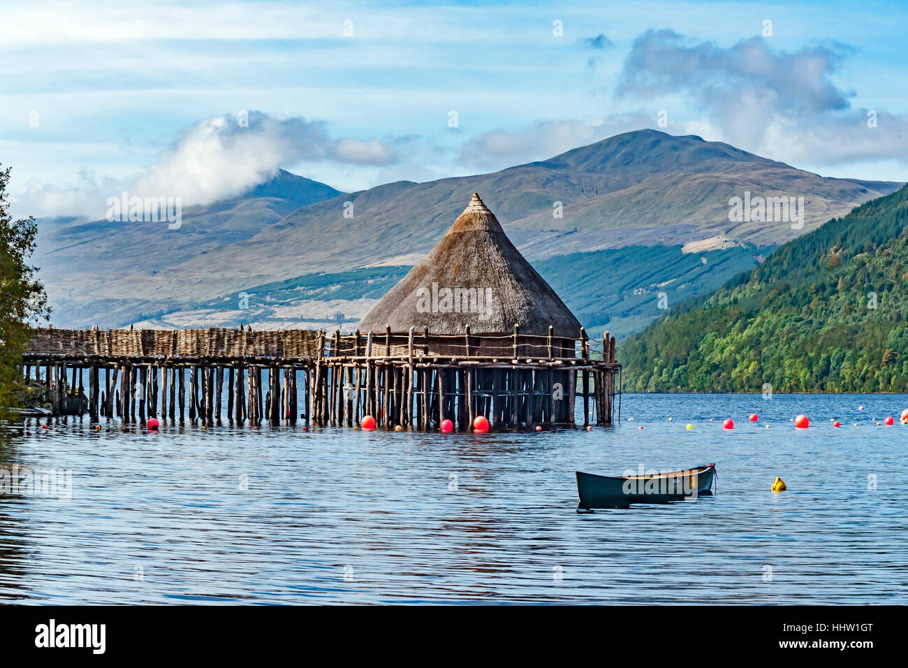 The Scottish Crannog Centre on Loch Tay near Kenmore Scotland as seen from the eastern shore of the loch with Ben Lawers distant Stock Photo