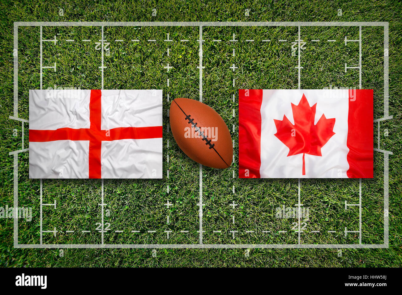 England vs. Canada flags on green rugby field Stock Photo Alamy