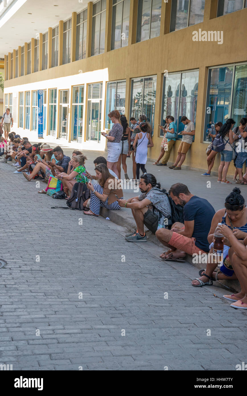 Cuban's using a hotels wi-fi for free Stock Photo