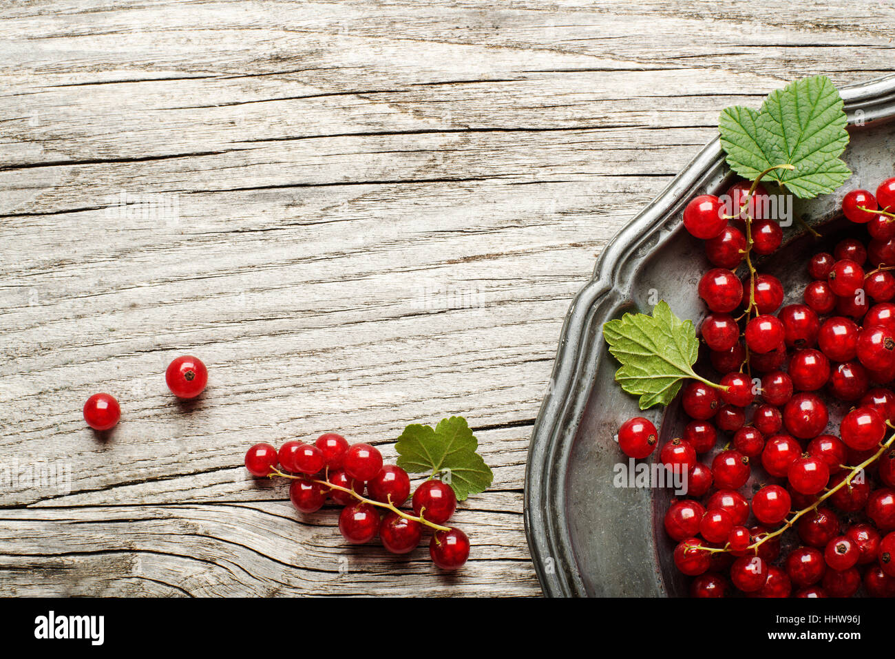 Fresh redcurrant on wooden background close up Stock Photo