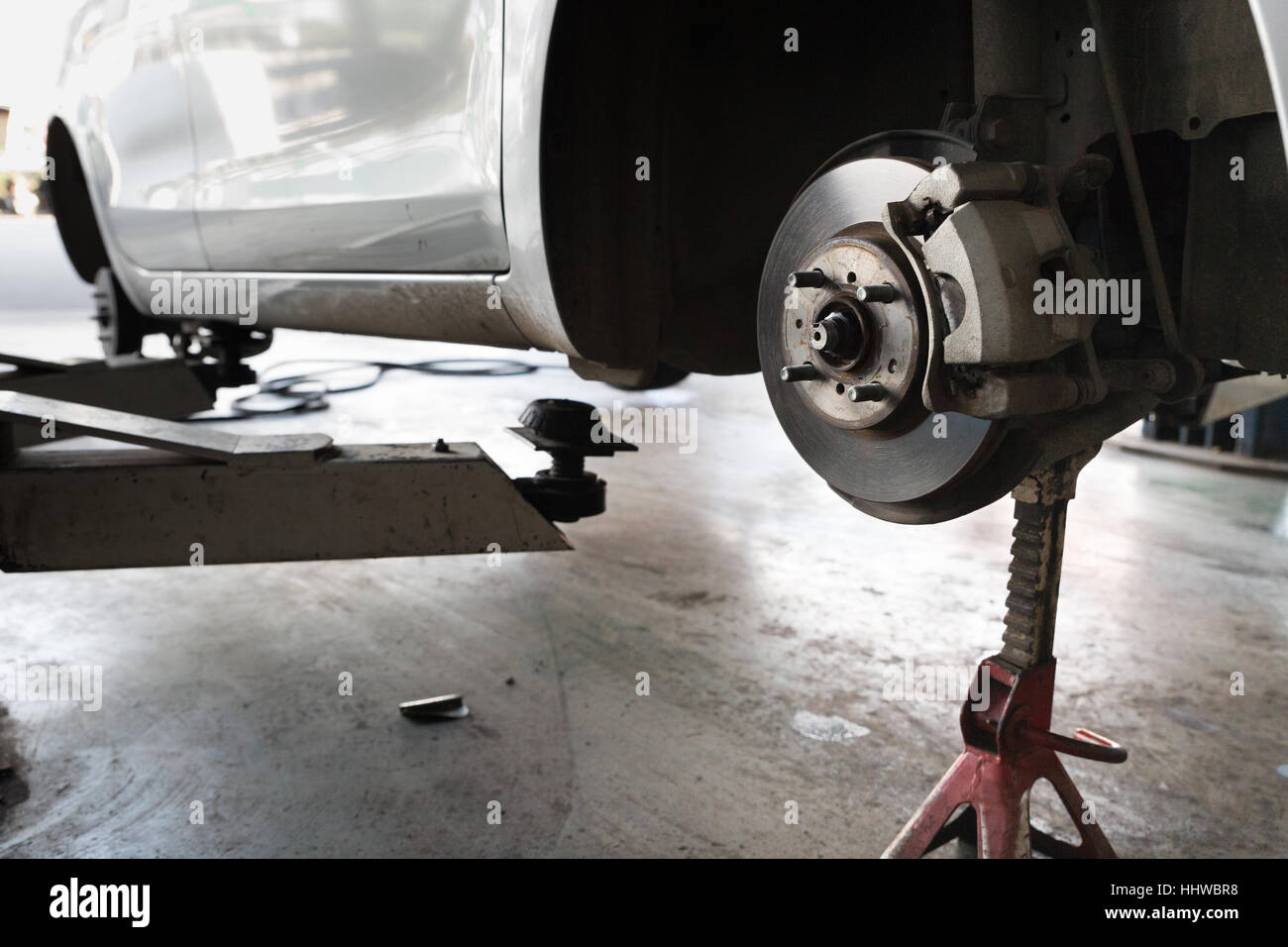 mechanic changing a wheel of a modern car, tire replacement service Stock Photo Alamy