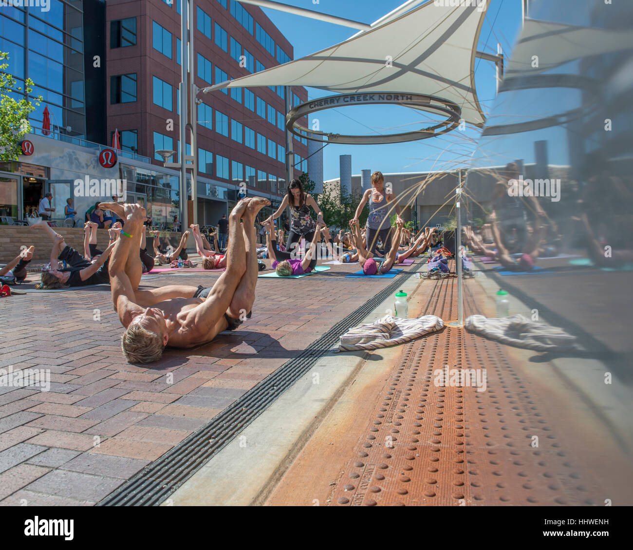 Outdoor yoga class, Cherry Creek North. Denver. Colorado. USA Stock