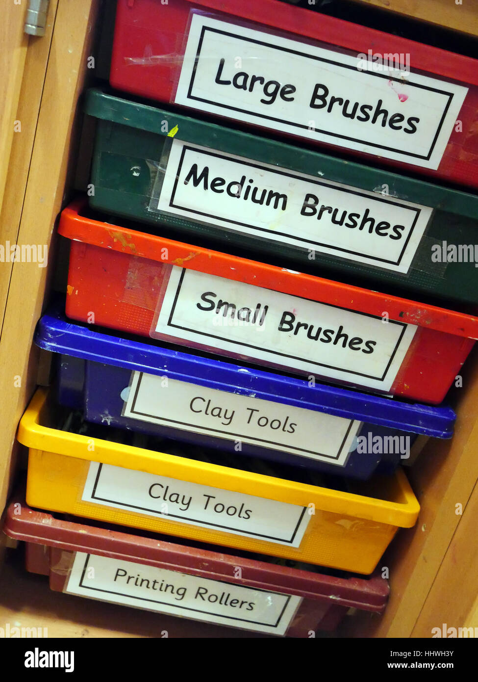 Trays of art materials and tools at a primary school Stock Photo