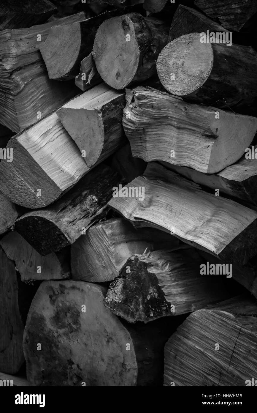 A pile of chopped wooden logs ready for log fire Stock Photo