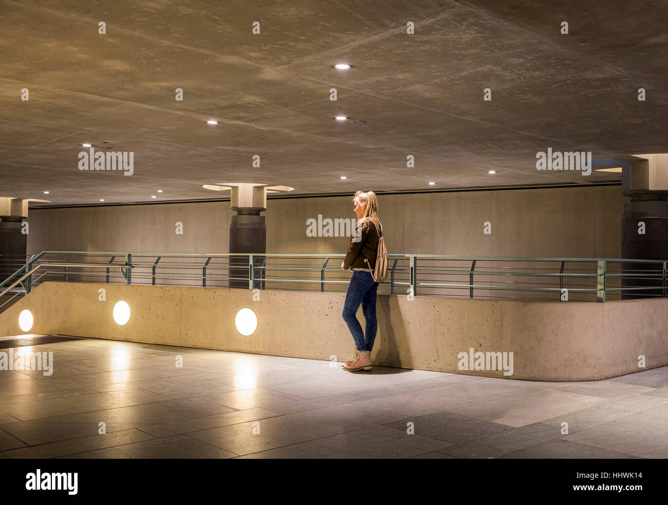 Teenager, young girl alone, entrance to underground station, Berlin, Germany Stock Photo