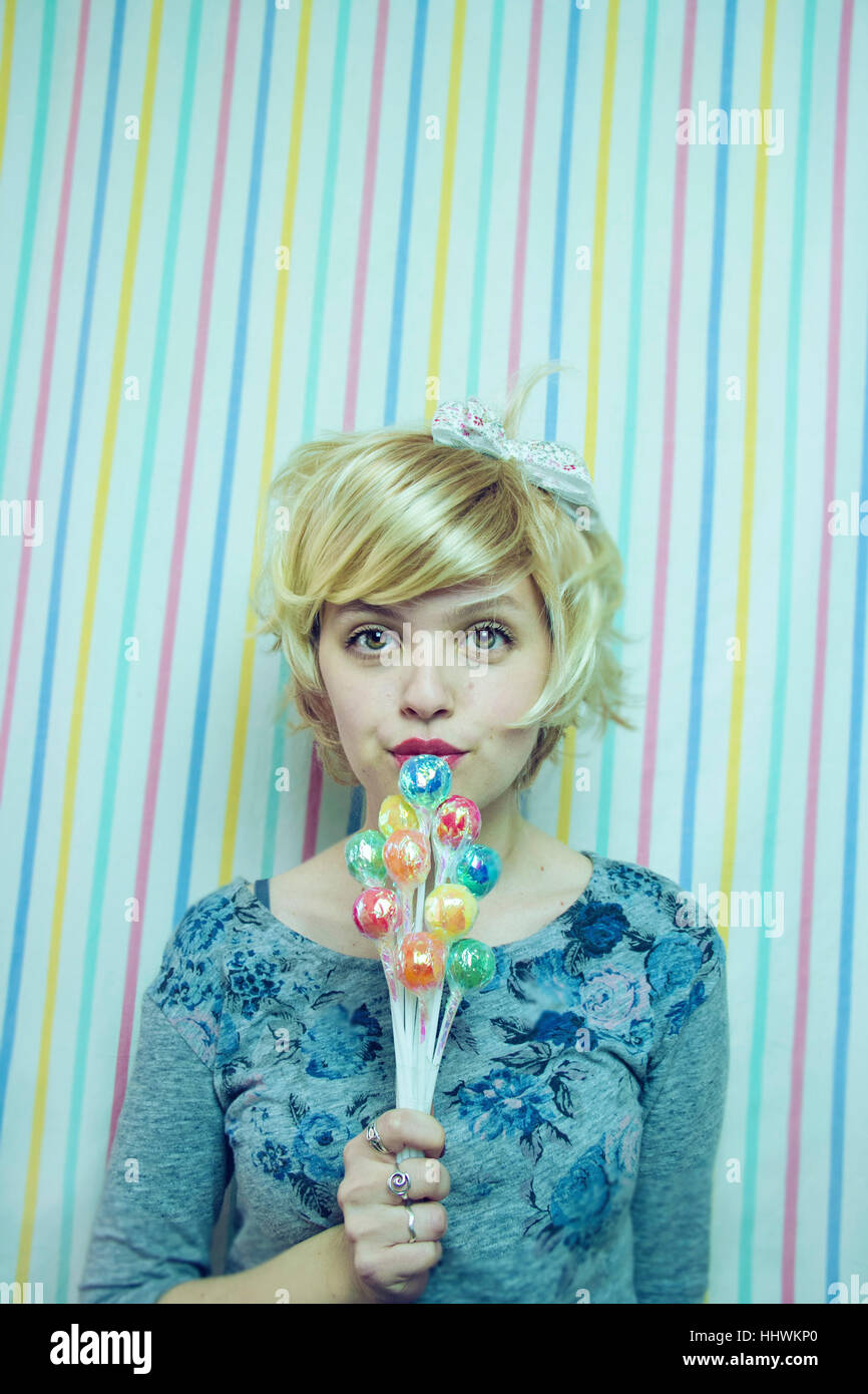 Young blond woman with a sweet look Stock Photo
