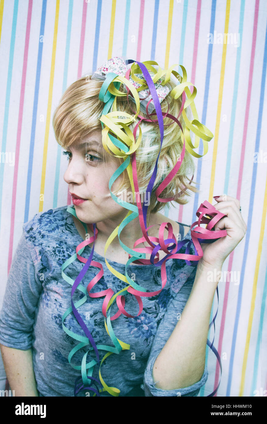 Lovely young woman in a birthday party Stock Photo