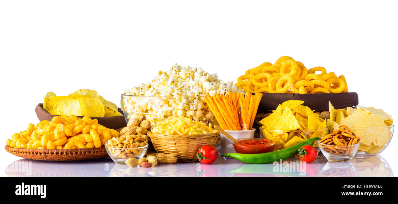 Different types of Junk-food on white background. Potato Chips, peanuts,  and popcorn Stock Photo - Alamy
