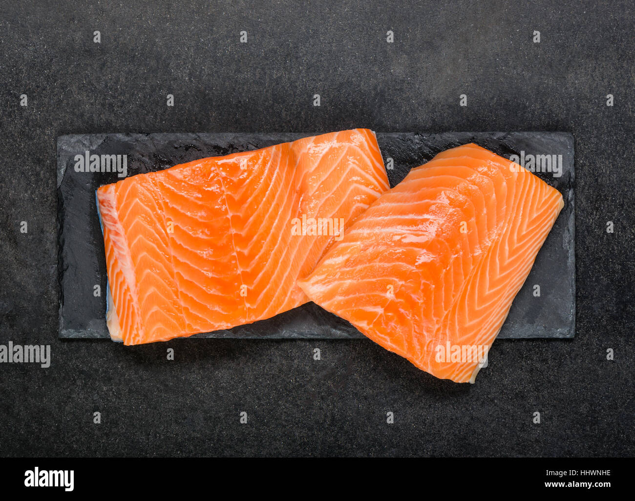 Red and Raw Salmon Fish Fillet in Top view on black background Stock ...