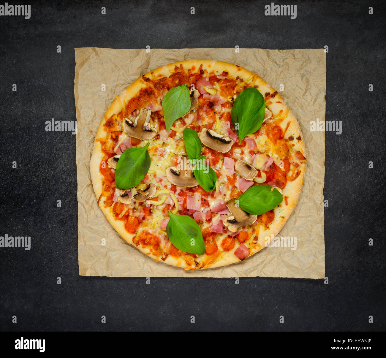 Baked Healty Food Pizza with Mushrooms, cheese and Basil on flatbread Stock Photo