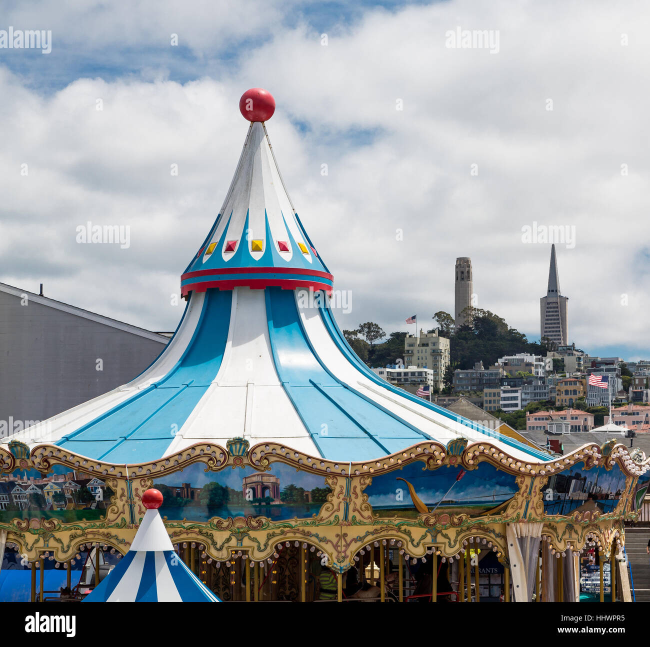 Top of carousel with two towers in the background Stock Photo