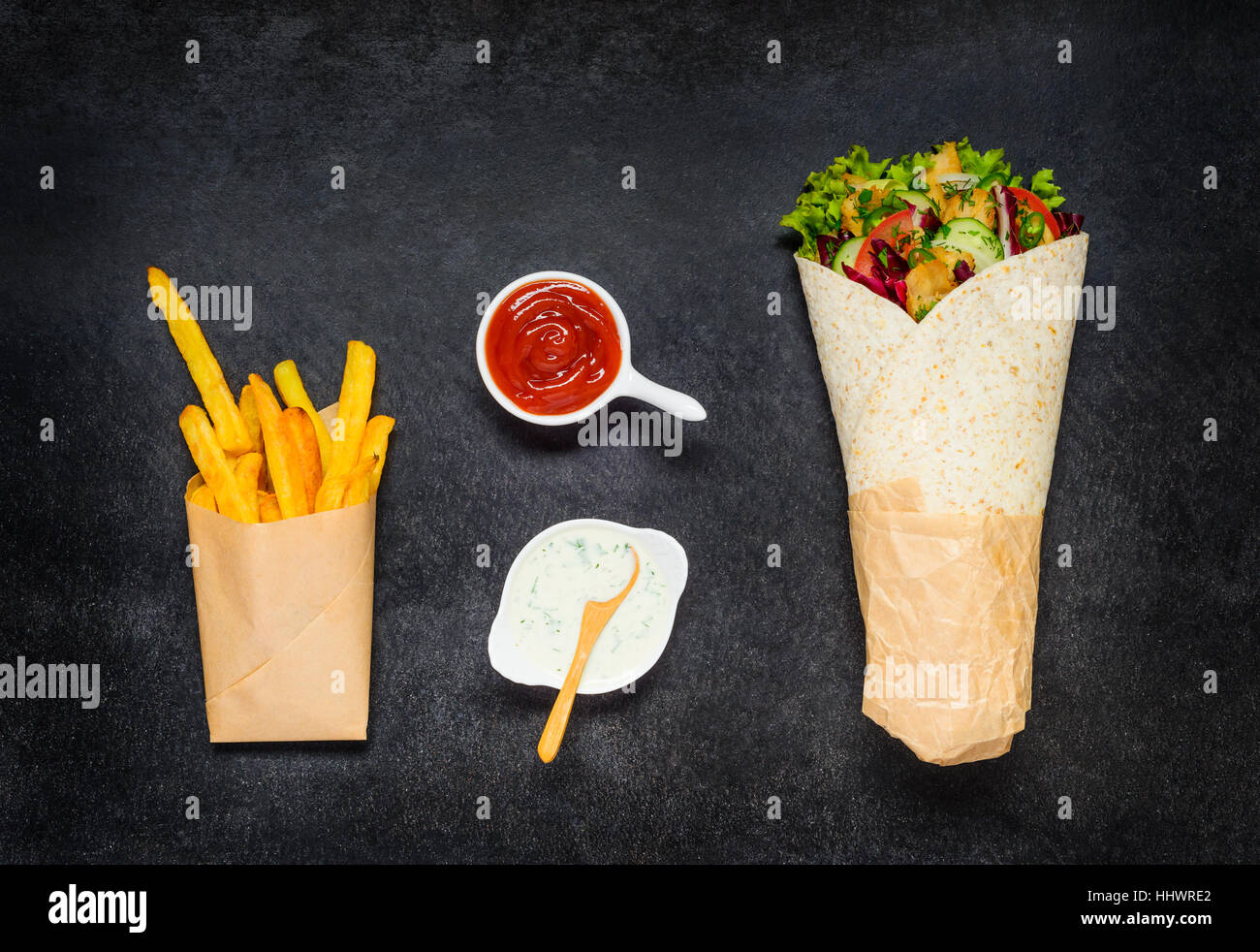 Shawarma Rolled Sandwich with French Fries, Ketchup white Sauce Stock