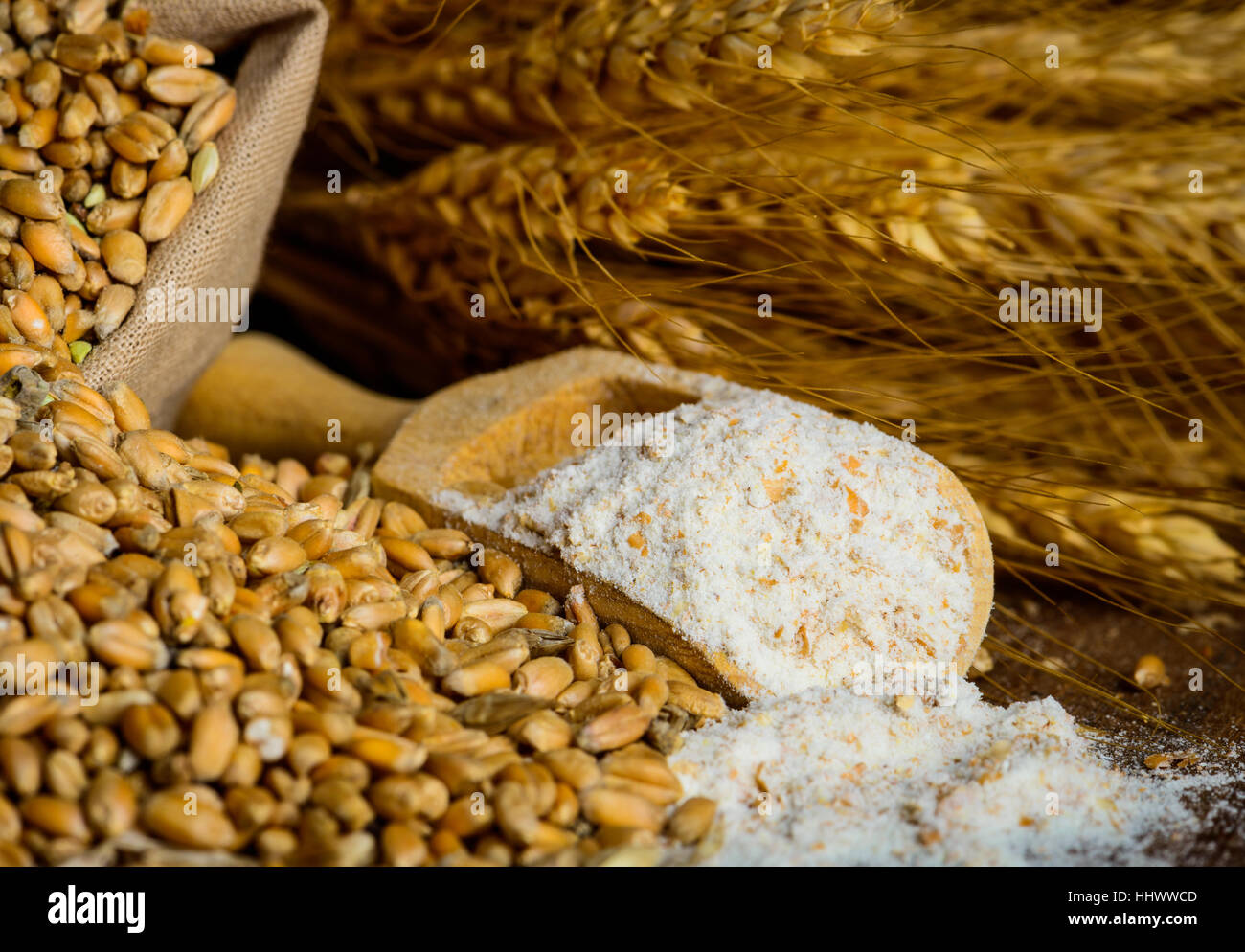 Milling wheat cereals grain ingredients into flour closeup Stock Photo
