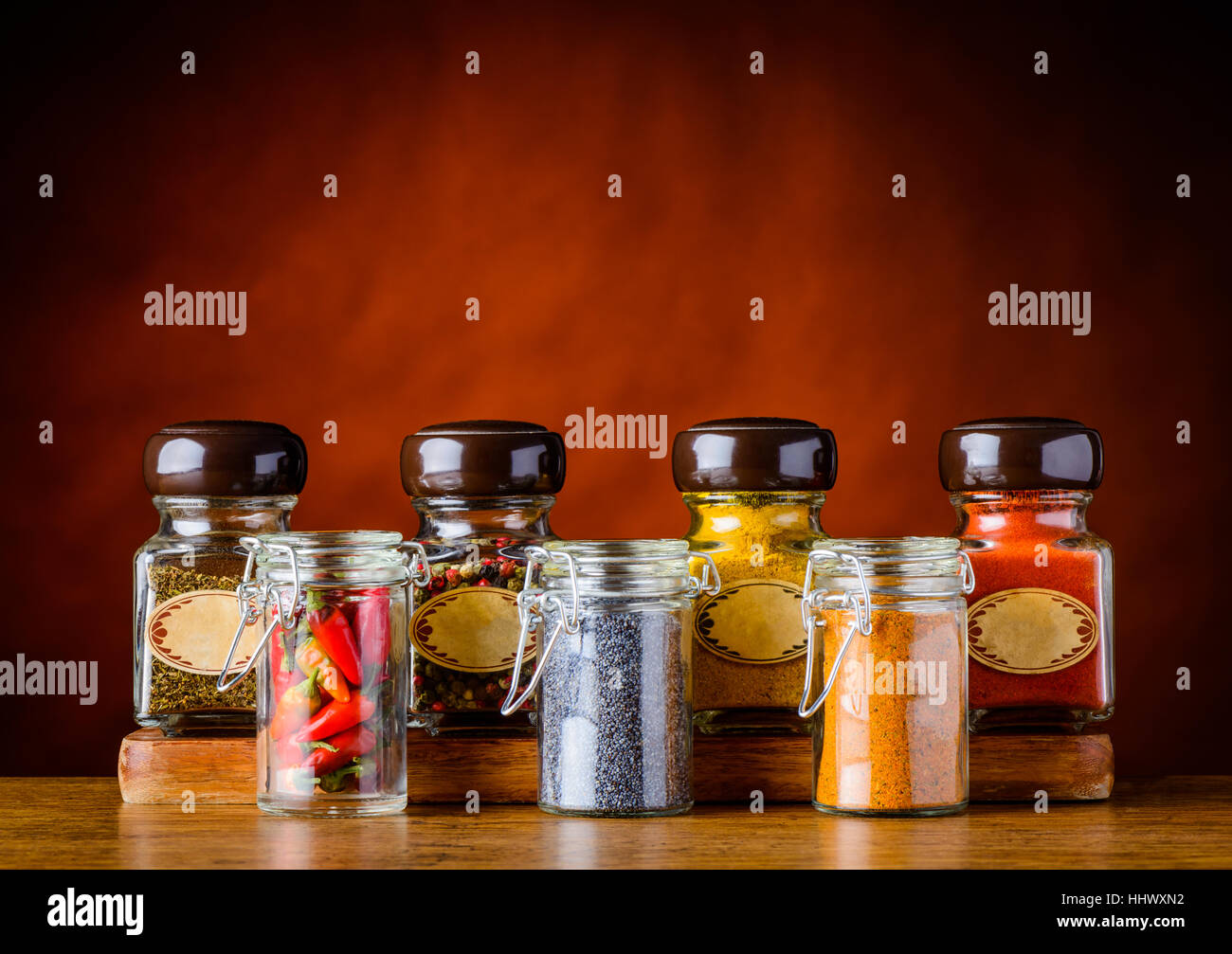 Glasses with different spices, pepper, curry, parsely, paprika, pepper Stock Photo