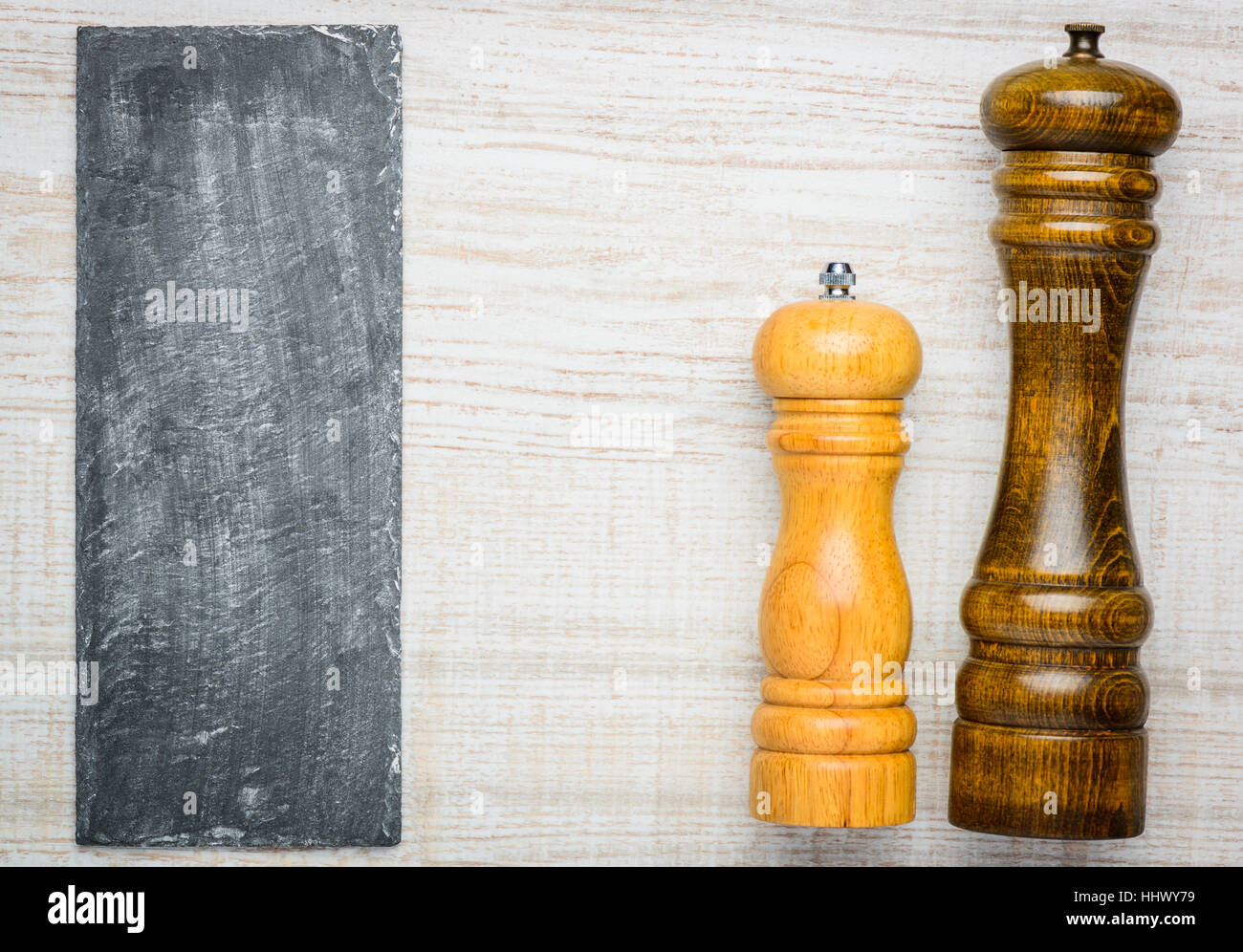 Wooden Salt and Pepper peppercorn mill grinder with copy space on slim