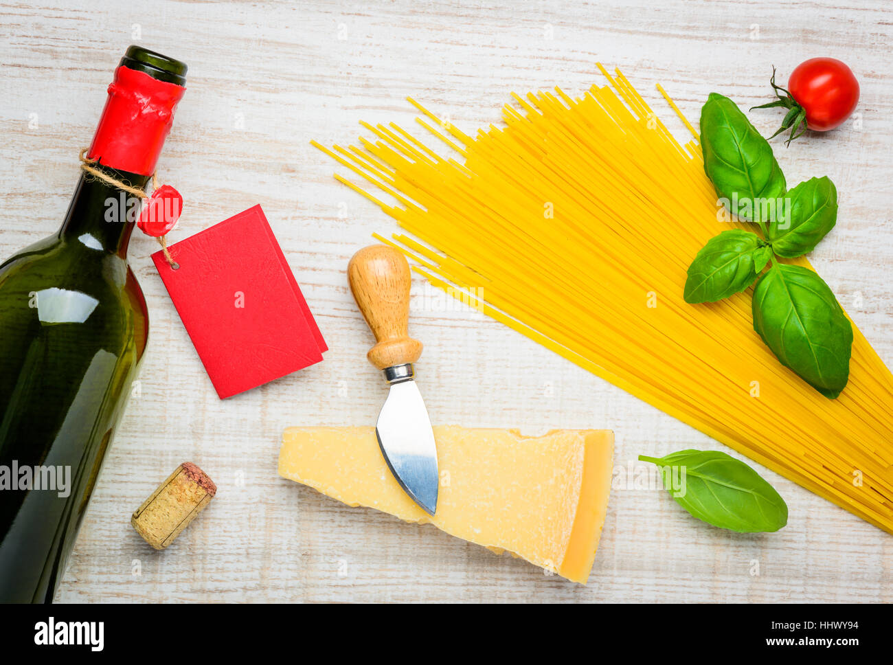 Bottle of Wine with red label, Parmigiano reggiano parmesan hard cheese ...