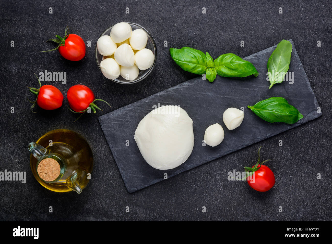Italian cuisine mozzarella cheese with fresh tomato and basil Stock Photo