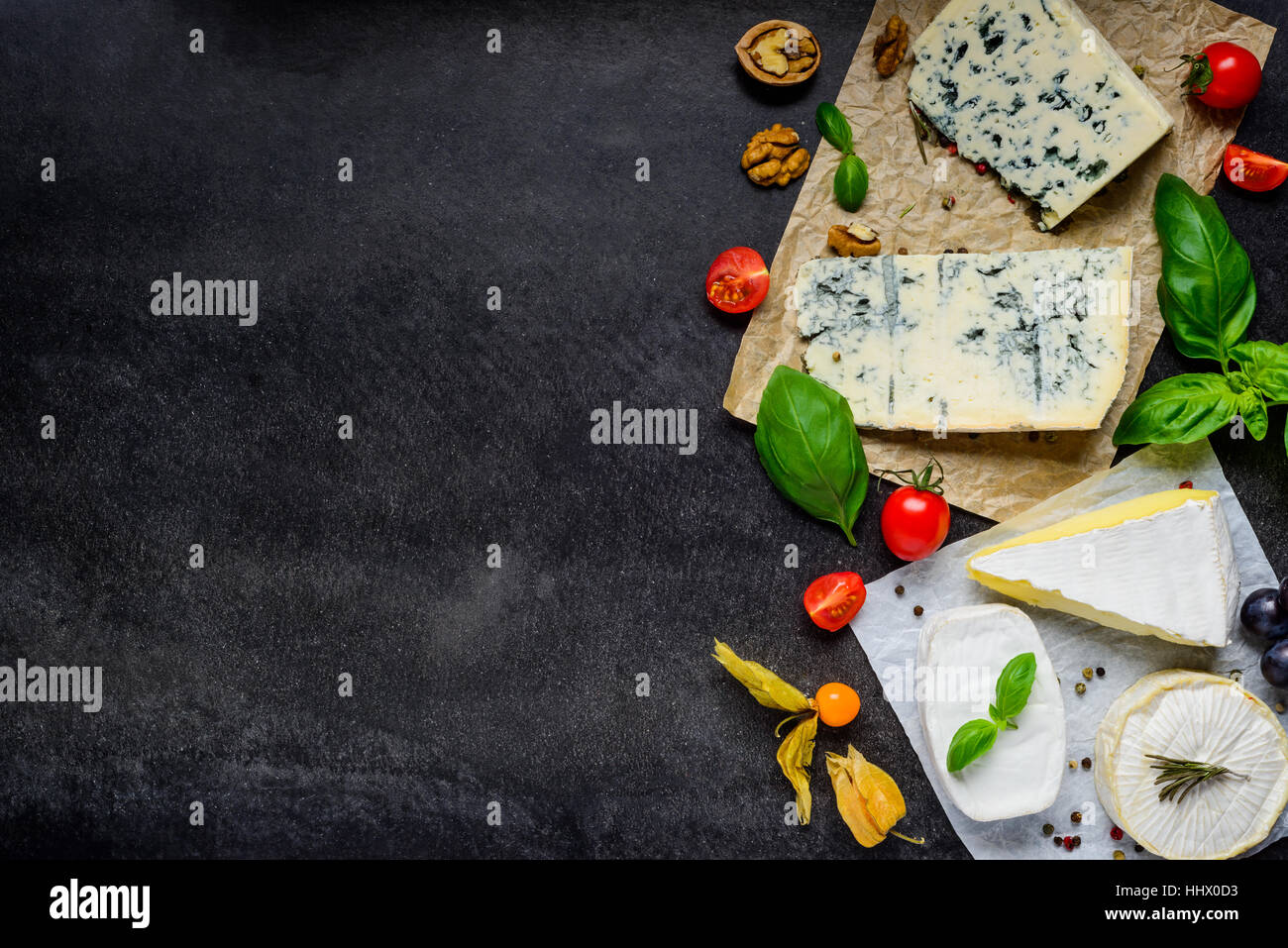 Danish Blue Mold Cheese and Camembert soft cheese with Basil and Copy Space Stock Photo