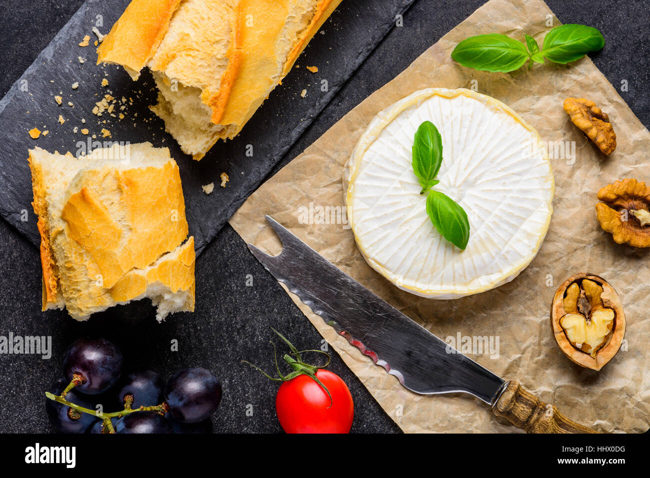 French Bread with Brie soft Cheese, grapes and nuts Stock Photo