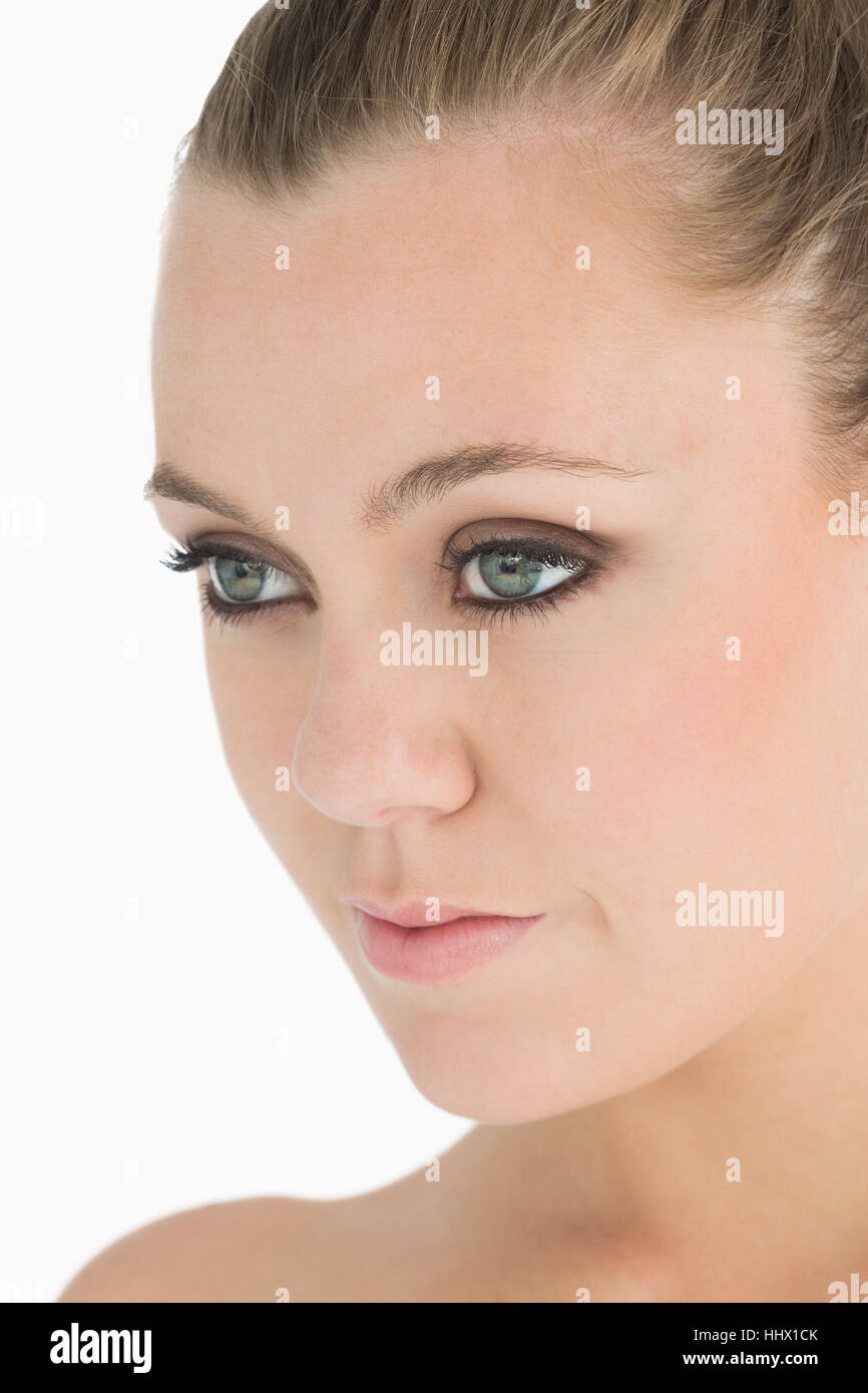 Blonde woman looking away on white background Stock Photo - Alamy