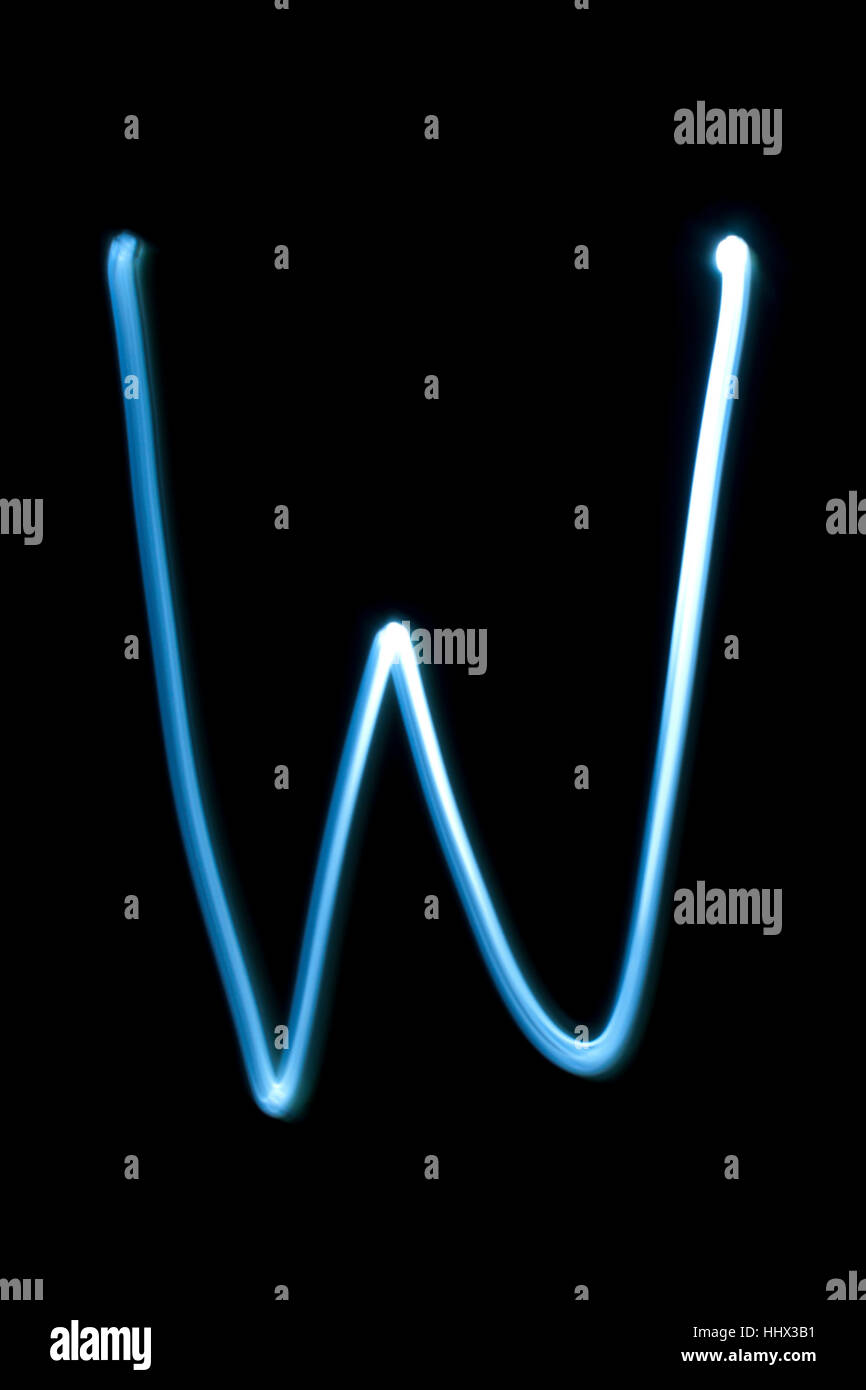 The letter W from natural neon light. Stock Photo