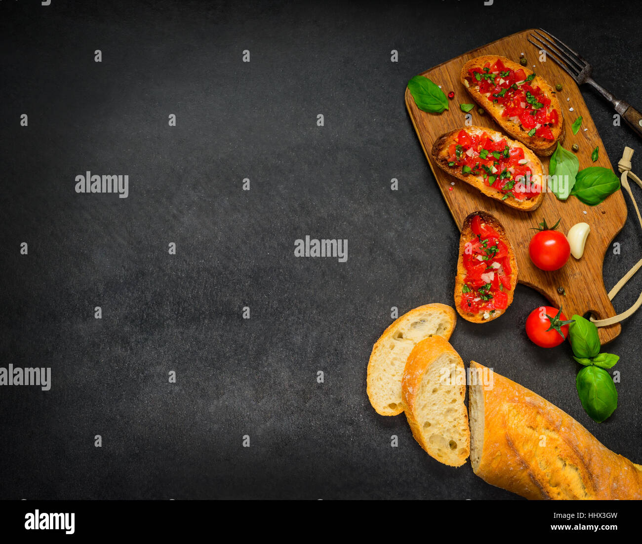 Bruschetta with French Bread and with Tomatoes and Basil on Copy Space Text Area Stock Photo
